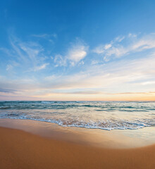 Looking out over the ocean from a deserted beach at dawn or dusk