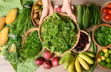 Organic Southeast Asian vegetables and fruits from local farmer market in summer season, Northern of Thailand, Sustainability concept, Table top view