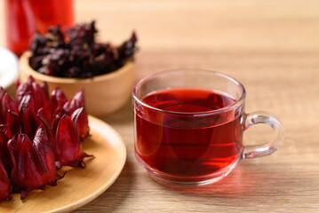 Roselle tea on wooden background (Hibiscus sabdariffa), Herbal medicine for reduction in blood pressure
