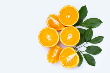 Orange fruit with green leaves on white background.