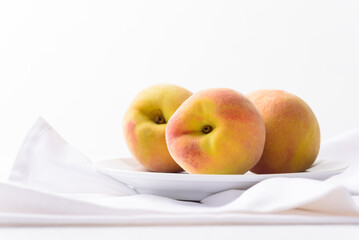 Fresh peach fruit on white background