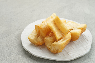 Fried casava or singkong goreng is Indonesian traditional food. Selected focus.
