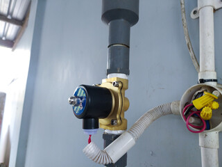 Solenoid Valve installed on the water pressure pipe line. - obrazy, fototapety, plakaty
