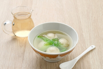 Ronde (Tang Yuan, glutinous rice dumpling balls) is a traditional warm drink made from ginger. The sticky rice balls in wedang ronde usually contain mashed beans and brown sugar. 
