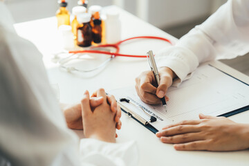 Doctor and patient are discussing consultation about symptom problem diagnosis of disease talk to the patient about medication and treatment method.