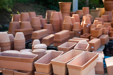 Clay pots of various shapes and sizes for flowers and garden plants for sale on open market