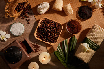 A closeup view of coffee bean and powder , salt  decorated with wooden tray candles and flower in wooden background for exfoliating advertising , mixture of coffee and salt 