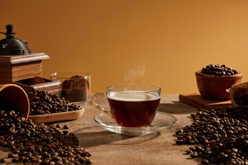 A closeup view of coffee decorated with coffee pack in wooden background for advertising 