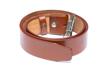 Genuine leather belt with metal buckle curled to circle on white background