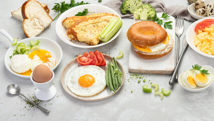 Various ways of cooking chicken eggs on light background.