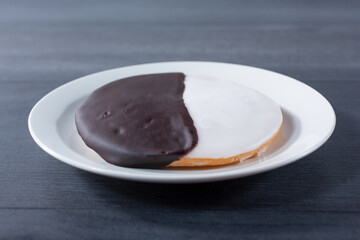 A view of a black and white cookie.