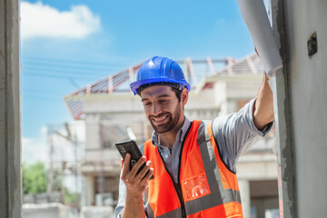 construction control engineer Workers, inspectors or architects in protective clothing are relaxing during breaks, smiling happily.