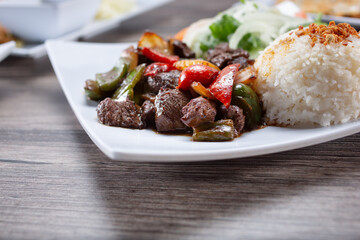A view of a plate of shaking beef.
