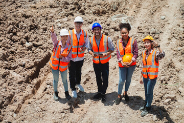 Diverse team of experts on the construction site. Real estate project with civil engineers, architects, business investors and construction workers Talking on the construction site