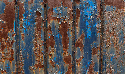 The texture of the fence from the old metal sheet. Sample of an old metal sheet.