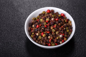 Pepper spice with peas of three different colors in a white saucer