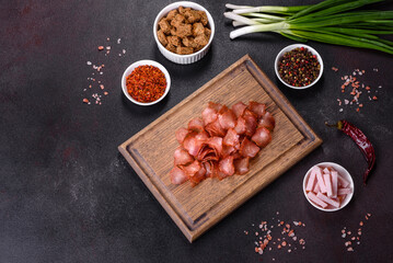 Snacks, jerky for beer on a black stone background