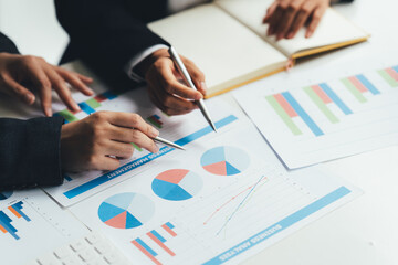 Team of business investment consultant analyzing company annual financial report balance sheet statement working with documents graphs. Concept picture of economy, market, office, money and tax