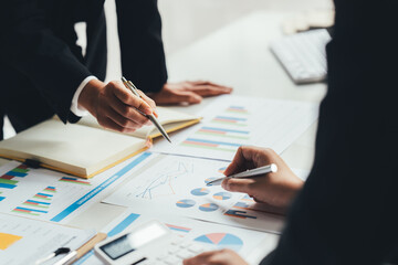 Business team analyzing income charts and graphs with modern laptop computer. Close up.Business analysis and strategy concept.