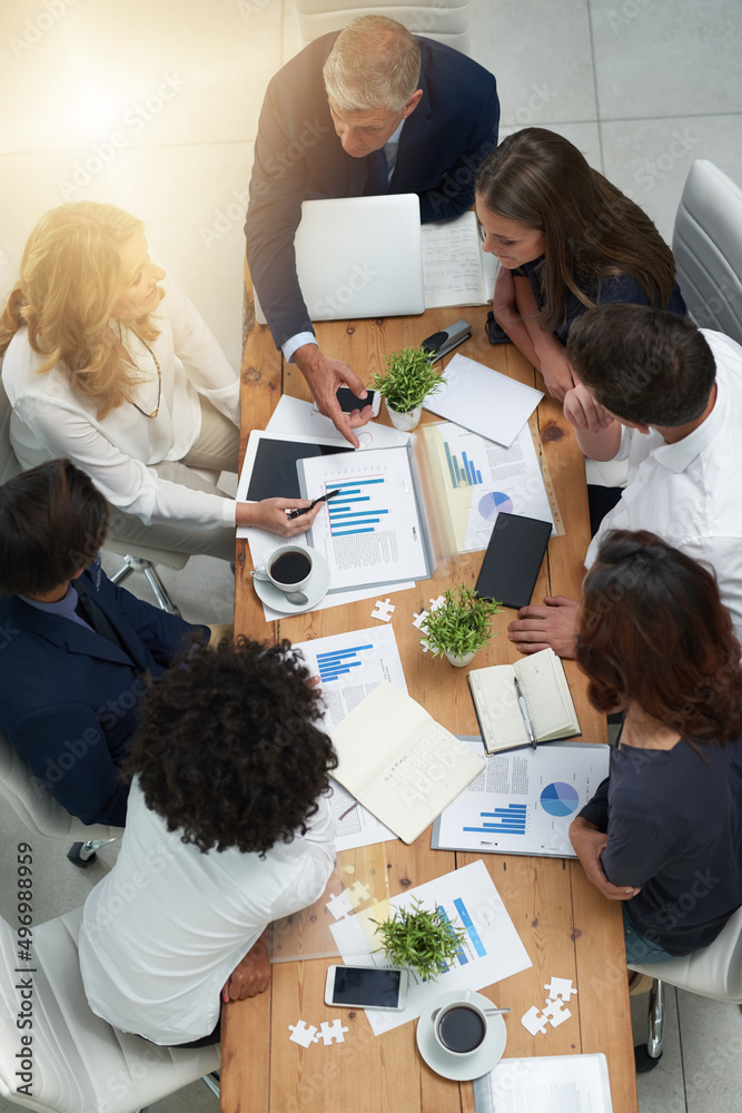 Aufkleber merging their ideas to create unfailing plans for success. high angle shot of a group of businesspeo