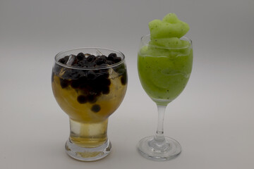 Pearl jasmine tea and kiwi juice on white background,Include Clipping Path.
