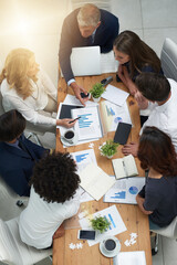 Merging their ideas to create unfailing plans for success. High angle shot of a group of...