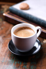 Cup of coffee on rustic wooden background. Close up.	