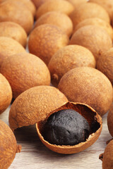 Dried longans on wooden table 