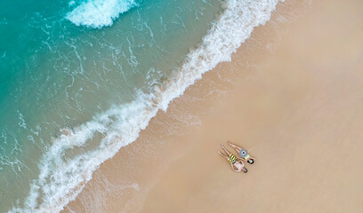 Aerial top view of Relaxation lifestyle with the couple in the holidaywith sand beaches -Summer  vacation in a holiday concept