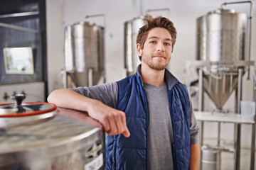 The master brewer himself. Portrait of a man working in a microbrewery.