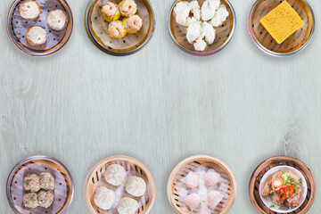 White wood grain background with eight different Hong Kong authentic steamer dim sum food material