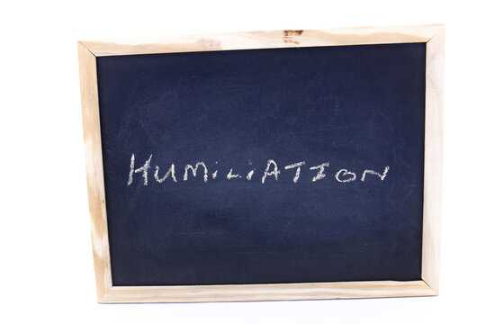 The term humiliation written on a chalkboard