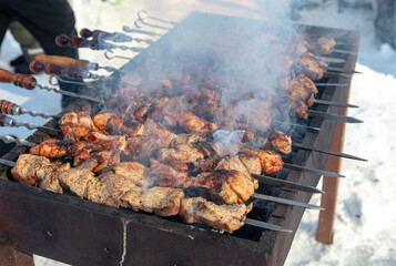 Meat on skewers is grilled on charcoal grills.