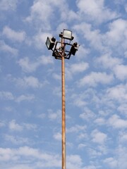 Stadium halogen spot light pole with blue sky background