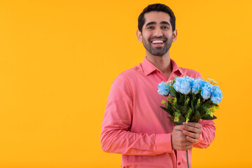 Portrait of happy young man holding flowers bouquet in his hands - Powered by Adobe