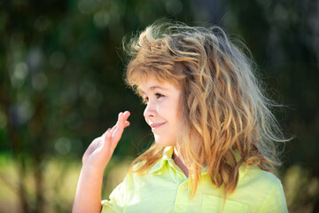 Portrait of smiling kid. Adorable little girl boy closeup outdoors in summer. Blonde child. Kids face close up. Funny blonde little child close up portrait.