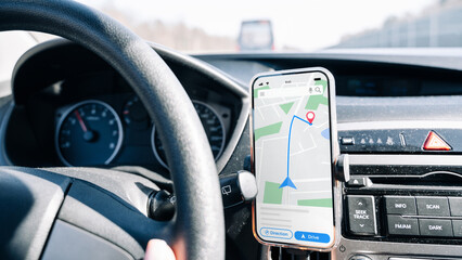 Gps device map system. Global positioning system on smartphone screen in auto car on travel road....