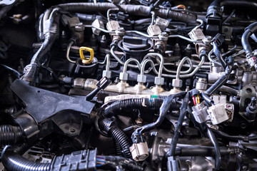 Engine car service mechanic maintenance inspection service maintenance car Check engine oil level car in garage showroom dealership blurred background.