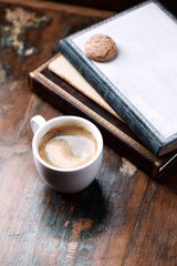 Cup of coffee on rustic wooden background. Copy space.