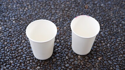 White disposable paper cups, compostable paper cups with blurred background 