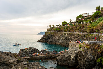 view from the Cinque Terre village of Manarola to the coastal hiking trail along the cliffs, Italy