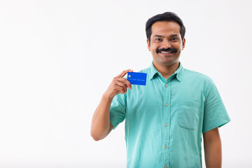 Portrait of a man displaying credit card in front of camera