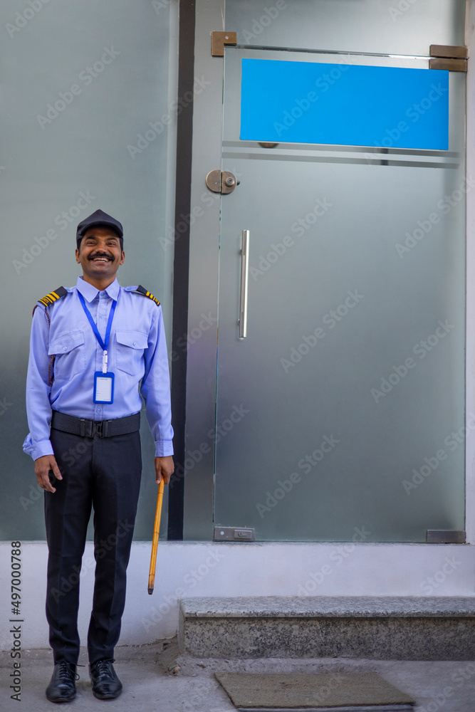 Wall mural security guard working in front of gate