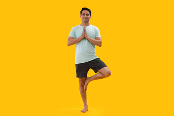 Fototapeta na wymiar Portrait of a young man practicing yoga 