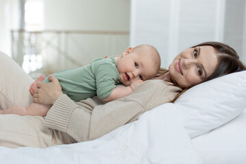 Fototapeta na wymiar A woman with a small child. Mom with a baby. High quality photo