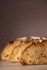 A loaf of bread on the table, sliced bread. High quality photo