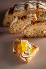 Fototapeta na wymiar A loaf of bread on the table, sliced bread. High quality photo
