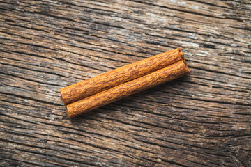 Dry cinnamon sticks on wooden table. Cinnamon spice.