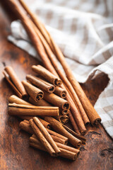 Dry cinnamon sticks on wooden table. Cinnamon spice.