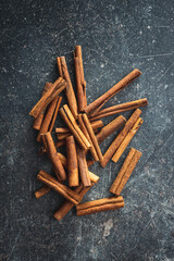 Dry cinnamon sticks on kitchen table. Cinnamon spice.